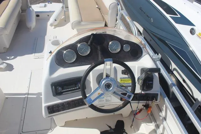 Slide: The Image of 2007 Hurricane FunDeck 196 RE3 boat dashboard with steering wheel and gauges. - 8