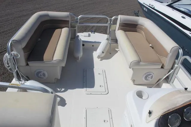 Slide: The Image of 2007 Hurricane FunDeck 196 RE3 boat interior with beige seating and spacious deck layout. - 9