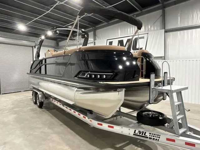 Slide: The Image of 2025 Harris Grand Mariner 250 SLDH pontoon boat on trailer in indoor storage. - 10