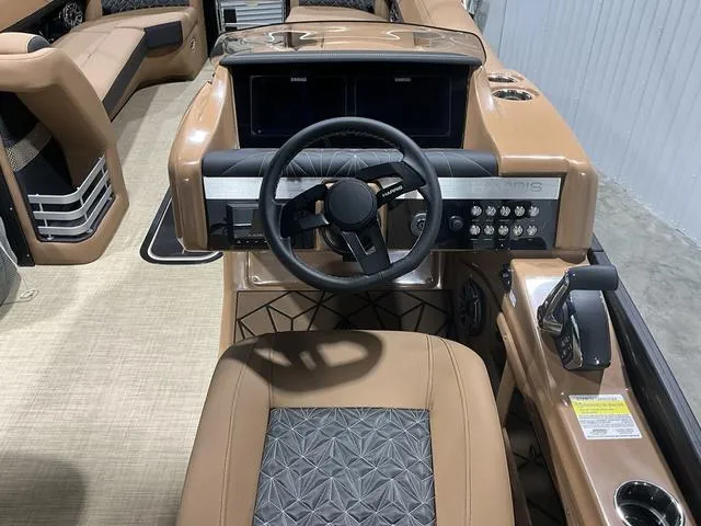 Slide: The Image of 2025 Harris GRAND MARINER 250 SLDH boat interior with steering wheel and control panel. - 11