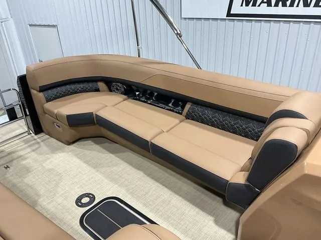 Slide: The Image of Luxurious seating on 2025 Harris GRAND MARINER 250 SLDH pontoon boat, featuring tan and black upholstery. - 17