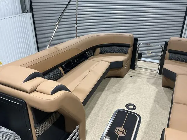 Slide: The Image of Luxurious interior of 2025 Harris GRAND MARINER 250 SLDH pontoon boat with tan seating. - 18