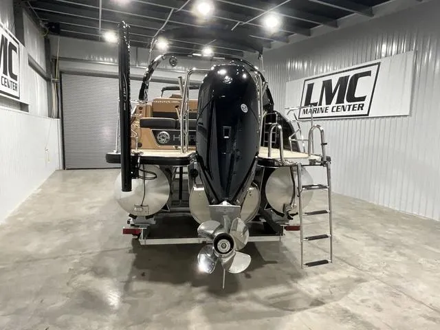 Slide: The Image of 2025 Harris GRAND MARINER 250 SLDH pontoon boat in showroom with outboard motor. - 5