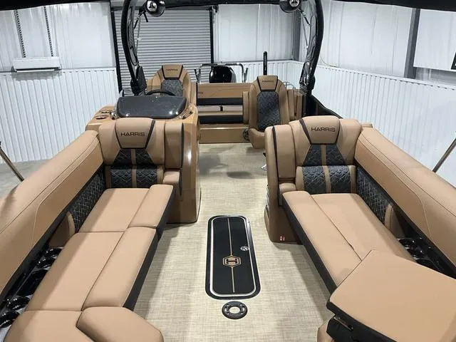 Slide: The Image of 2025 Harris GRAND MARINER 250 SLDH pontoon boat with luxurious tan seating and modern design. - 8