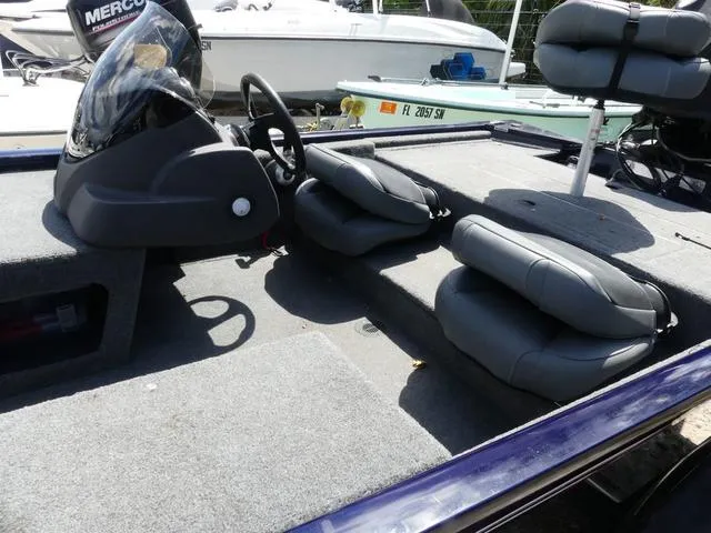 Slide: The Image of 2022 Tracker Pro 170 boat interior with steering console and seating. - 5