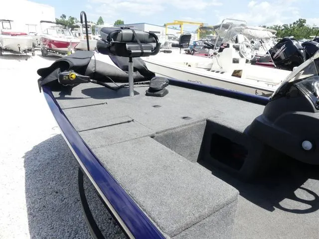 Slide: The Image of 2022 Tracker Pro 170 boat with spacious deck and seating, displayed outdoors. - 7