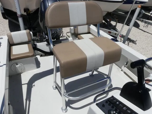 Slide: The Image of 2019 Parker 1801 CC boat interior with beige and white seating. - 14