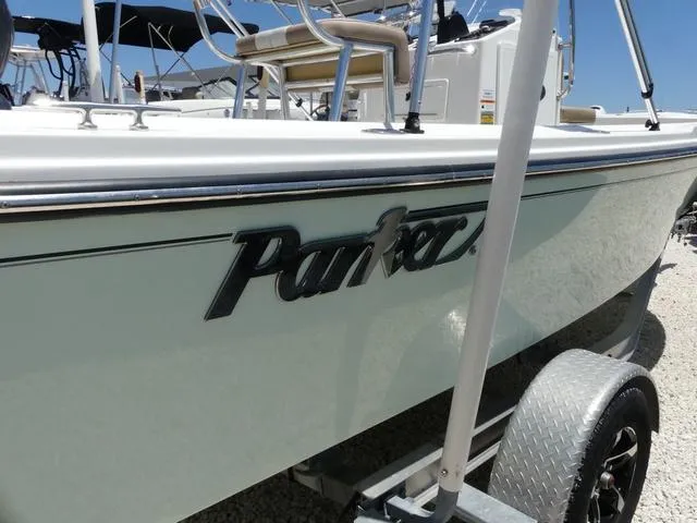 Slide: The Image of 2019 Parker 1801 CC boat on trailer, side view with logo visible. - 3