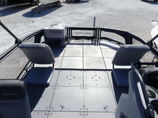 Slide: The Image of 2023 Sea-Doo Switch® 16-130 hp pontoon boat interior with seating and storage. - 10