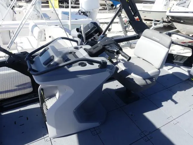 Slide: The Image of 2023 Sea-Doo Switch® 16-130 hp boat interior with steering console and seating. - 7