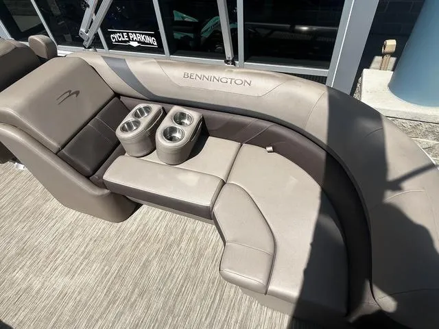 Slide: The Image of 2022 Bennington 22 SXSR Tri-Toon Pontoon seating with cup holders, beige upholstery. - 15