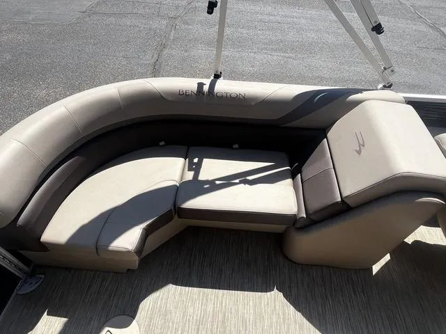 Slide: The Image of 2022 Bennington 22 SXSR Tri-Toon Pontoon with beige seating and stylish design. - 16