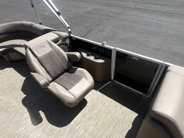 Slide: The Image of 2022 Bennington 22 SXSR Tri-Toon Pontoon interior with plush seating and cup holders. - 17