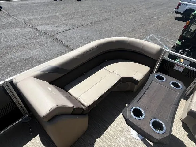 Slide: The Image of 2022 Bennington 22 SXSR Tri-Toon Pontoon with beige seating and cupholders on deck. - 18