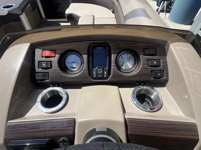 Slide: The Image of Dashboard of 2022 Bennington 22 SXSR Tri-Toon Pontoon with gauges and controls. - 22