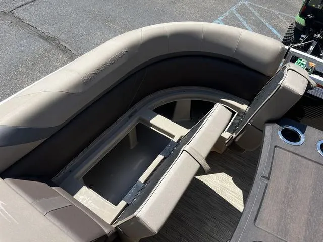 Slide: The Image of 2022 Bennington 22 SXSR Tri-Toon Pontoon interior seating with storage compartment. - 25