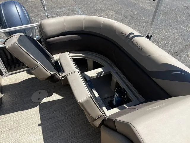 Slide: The Image of 2022 Bennington 22 SXSR Tri-Toon Pontoon with open storage compartment and cushioned seating. - 29