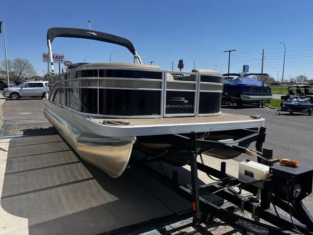 Slide: The Image of 2022 Bennington 22 SXSR Tri-Toon Pontoon on trailer in parking lot, sunny day. - 5