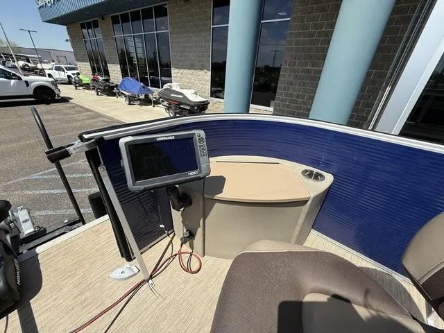 Slide: The Image of 2022 Bennington 23 SFXAPG boat interior with navigation system and seating area. - 10