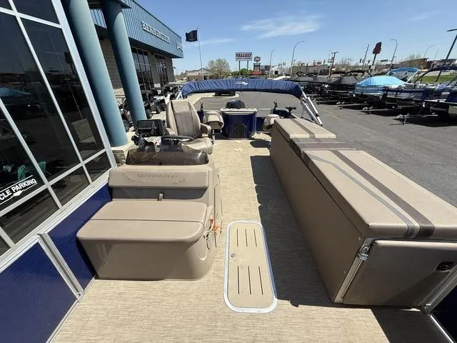 Slide: The Image of 2022 Bennington 23 SFXAPG pontoon boat with spacious seating and modern design. - 14