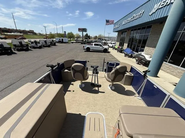 Slide: The Image of 2022 Bennington 23 SFXAPG pontoon boat at dealership, outdoor view. - 16