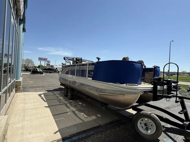 Slide: The Image of 2022 Bennington 23 SFXAPG pontoon boat on trailer in parking lot. - 4