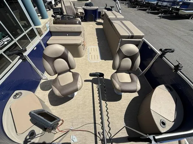 Slide: The Image of 2022 Bennington 23 SFXAPG pontoon boat interior with seating and fishing equipment. - 9