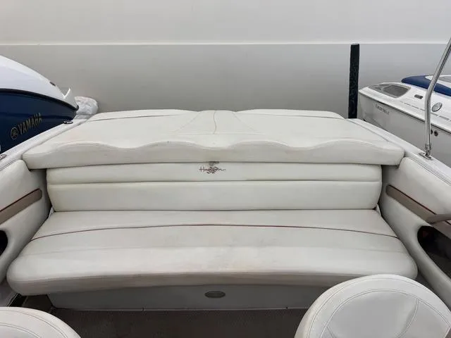 Slide: The Image of 2005 Four Winns 190LE boat interior with white cushioned seating. - 5