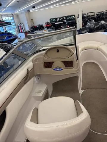 Slide: The Image of 2005 Four Winns 190LE boat interior with steering wheel and control panel. - 8