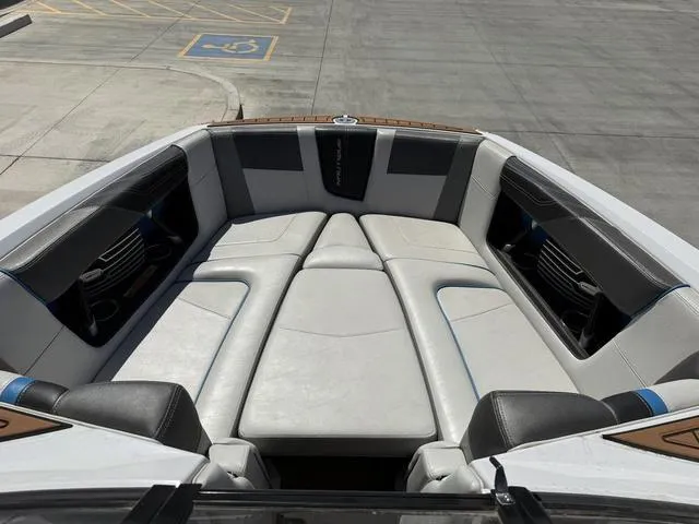 Slide: The Image of 2013 Nautique G23 boat interior with spacious seating and modern design. - 11