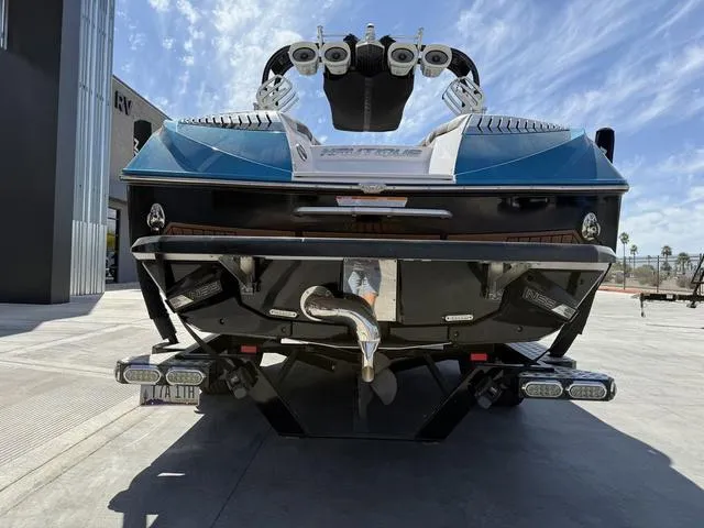 Slide: The Image of 2013 Nautique G23 boat rear view with wakeboard tower and exhaust system. - 7