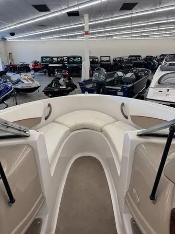 Slide: The Image of White leather seat in a 2005 Four Winns 190LE boat interior. - 12