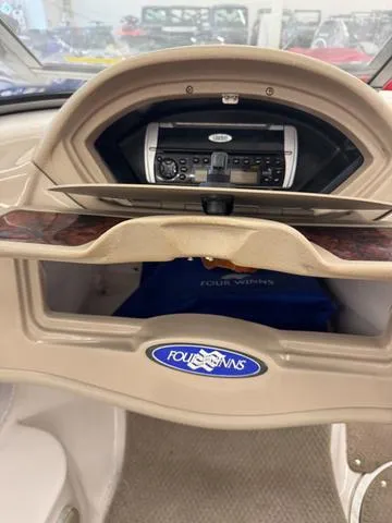 Slide: The Image of Interior cabin of 2005 Four Winns 190LE boat with patterned upholstery and overhead hatch. - 16