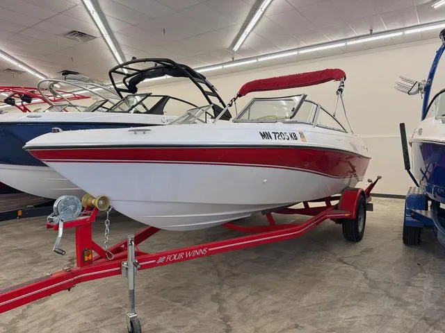 Slide: The Image of 2005 Four Winns 190LE boat on trailer in indoor showroom. - 2