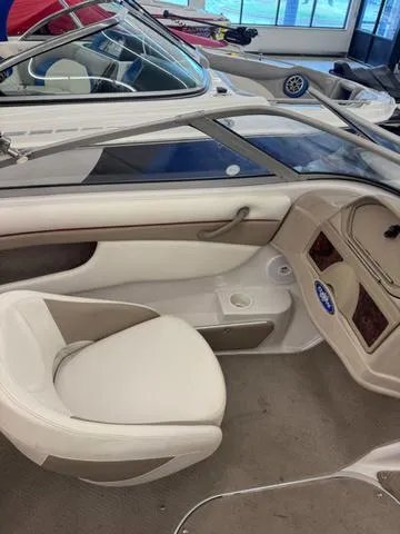 Slide: The Image of 2005 Four Winns 190LE boat dashboard with steering wheel and navigation system. - 9