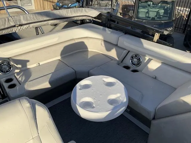 Slide: The Image of 2023 Hurricane FunDeck 2260 REF OB boat interior with seating and table. - 10