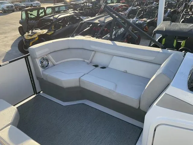 Slide: The Image of 2023 Hurricane FunDeck 2260 REF OB boat interior with spacious seating and modern design. - 14