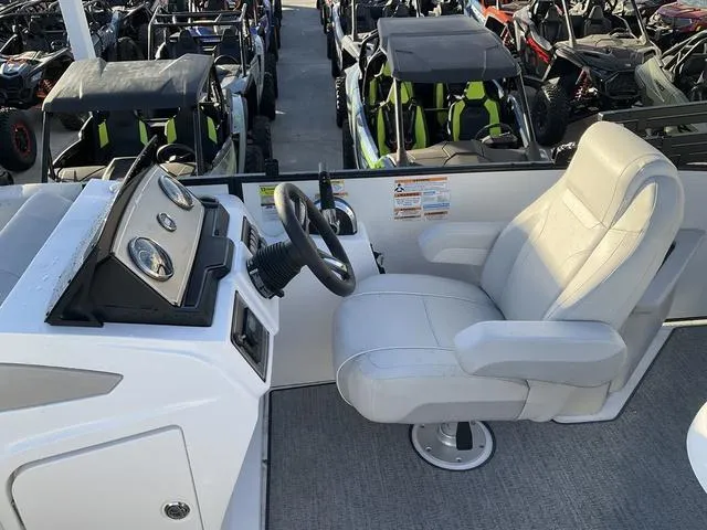 Slide: The Image of Captain's seat and console of 2023 Hurricane FunDeck 2260 REF OB boat. - 15