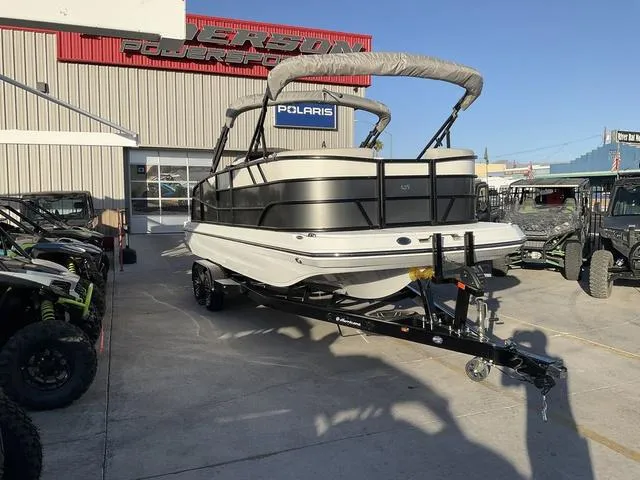 Slide: The Image of 2023 Hurricane FunDeck 2260 REF OB boat on trailer at dealership. - 3