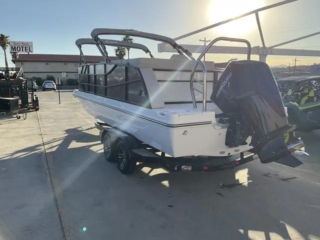 Slide: The Image of 2023 Hurricane FunDeck 2260 REF OB boat in a sunny outdoor setting. - 7