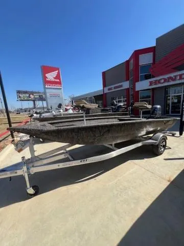 Slide: The Image of 2025 Xpress Boats HD 16 DB on trailer outside Honda dealership. - 7