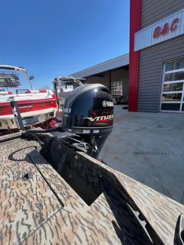 Slide: The Image of 2025 Xpress Boats XP180 with Yamaha VMAX engine, parked outside a dealership. - 13