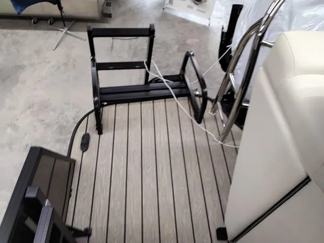 Slide: The Image of 2025 Lowe SS 210 TL boat interior with foldable ladder and seating. - 7