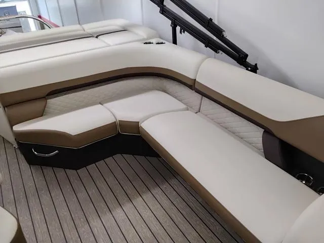 Slide: The Image of Luxurious seating on 2025 Lowe SS 210 TL boat with beige and brown upholstery. - 8