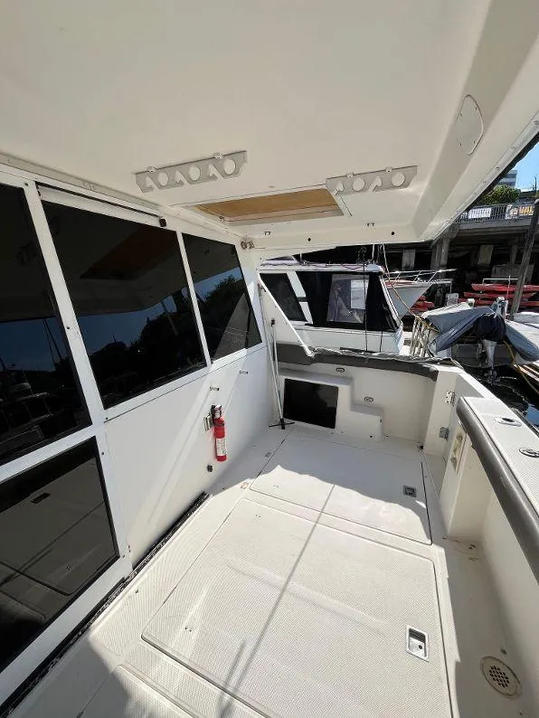 Slide: The Image of 1996 Bayliner 4788 yacht deck with modern amenities and spacious layout. - 15