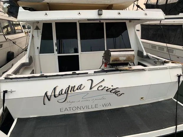 Slide: The Image of 1996 Bayliner 4788 yacht named "Magna Veritas" docked in Eatonville, WA. - 2