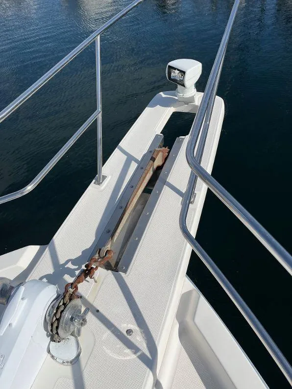 Slide: The Image of Bow of 1996 Bayliner 4788 yacht with anchor and railing. - 21