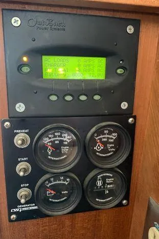 Slide: The Image of Control panel of a 1996 Bayliner 4788 yacht with gauges and digital display. - 36