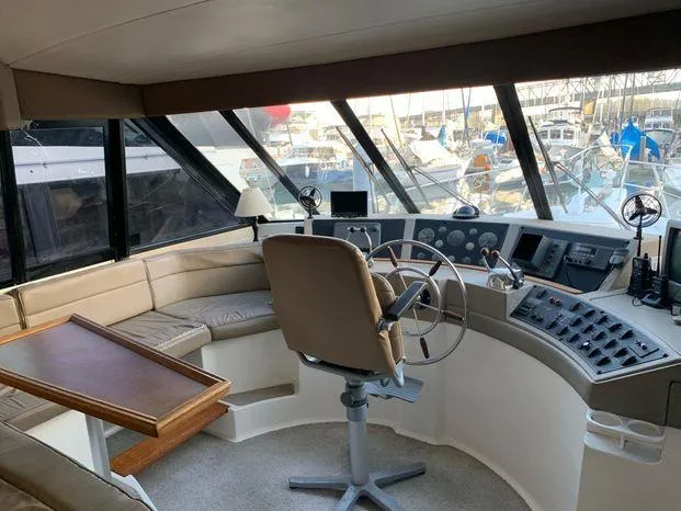 Slide: The Image of Interior helm of 1996 Bayliner 4788 yacht with steering wheel and control panel. - 40