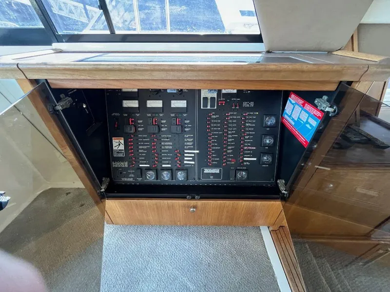 Slide: The Image of Electrical panel inside a 1996 Bayliner 4788 yacht, featuring switches and controls. - 41